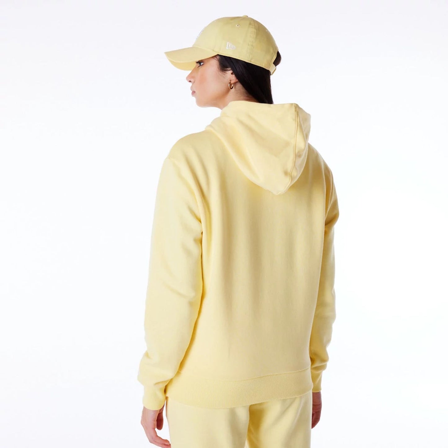 The Female model is wearing LA Dodgers Womens MLB League Essential Pastel Yellow Pullover Hoodie 6