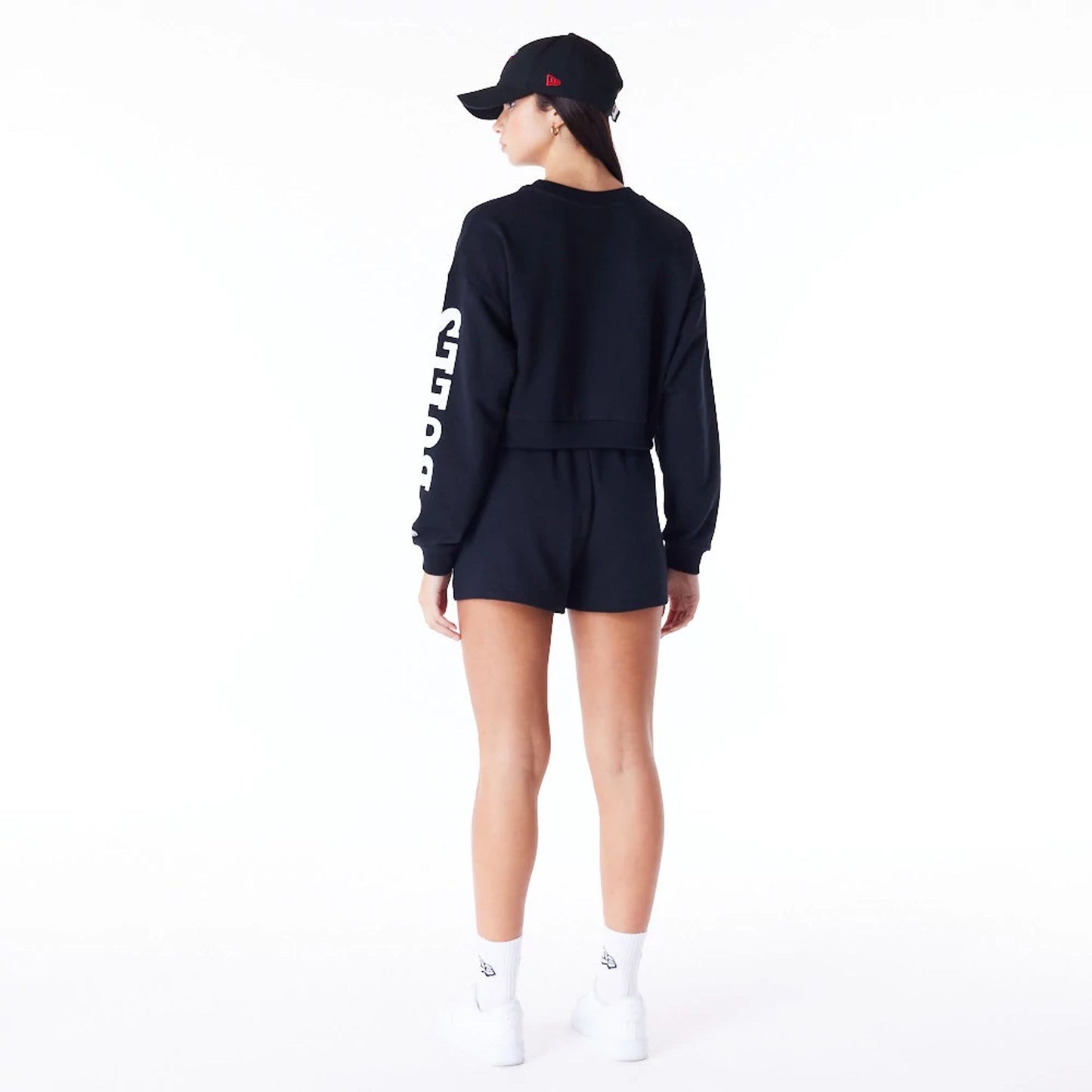 The Female model is wearing Chicago Bulls Womens NBA Wordmark Black Crop Crew Neck Sweatshirt 3