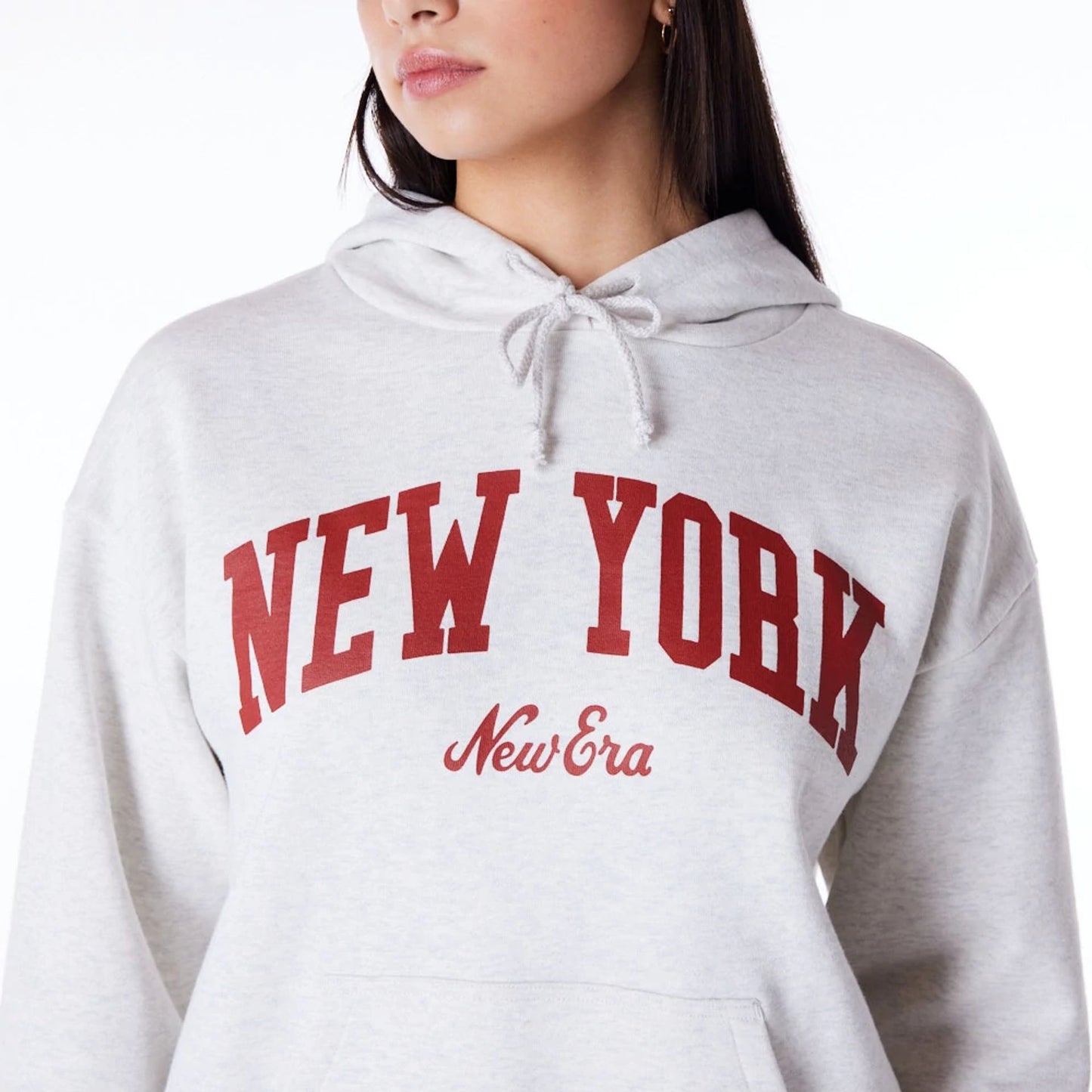 The Female model is wearing New Era Infill Grey Oversized Pullover Hoodie 5