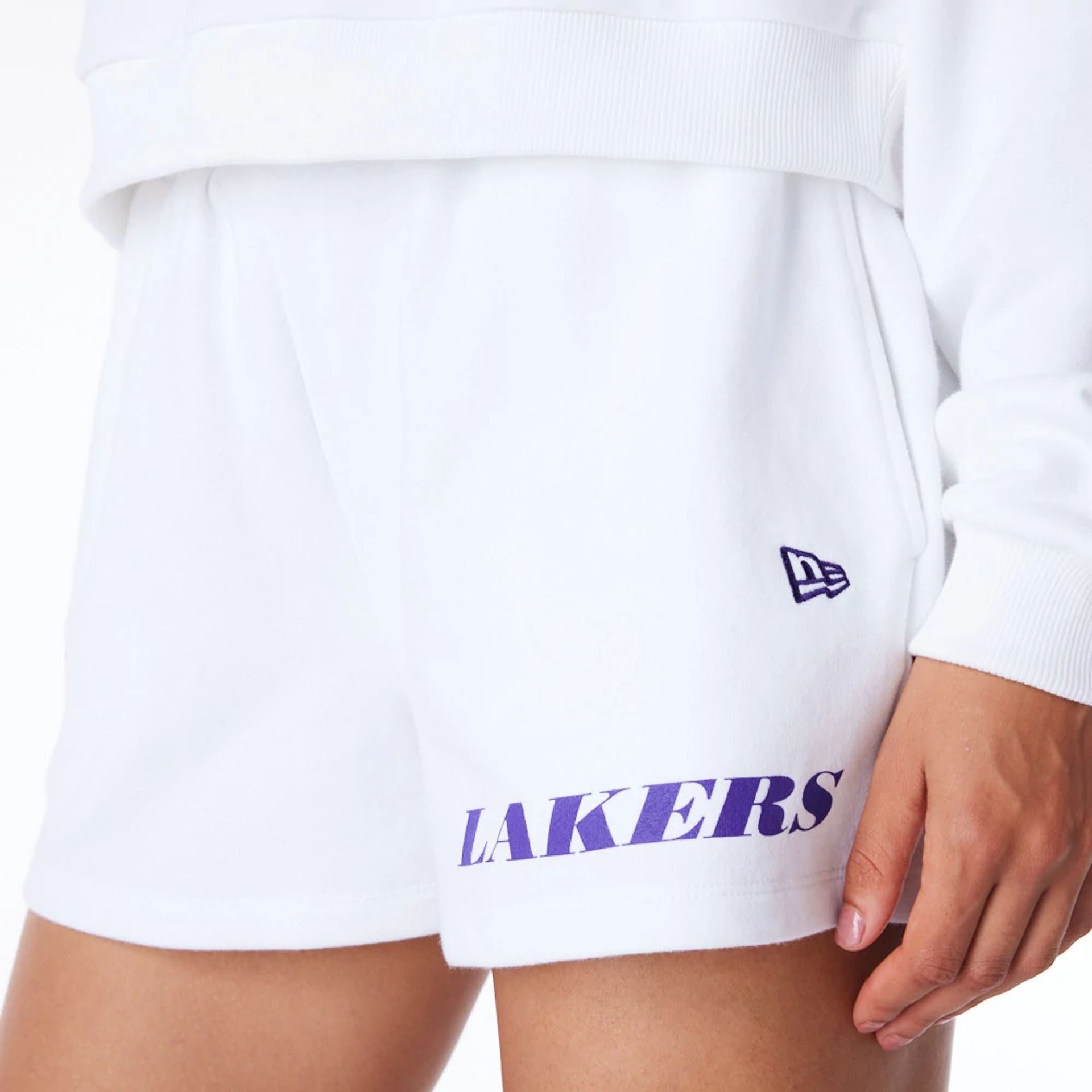 The Female model is wearing LA Lakers Womens NBA Wordmark White Shorts 5