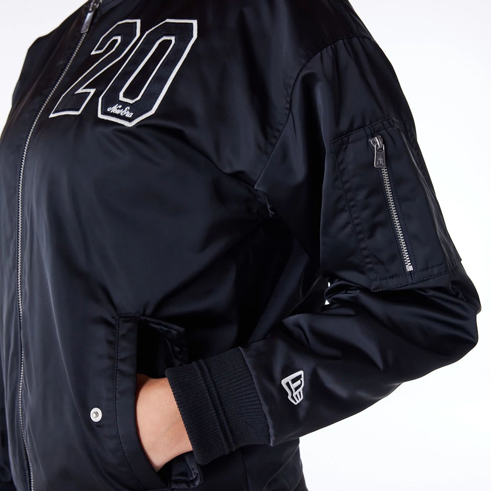 The Female model is wearing New Era Womens Black Bomber Jacket 4