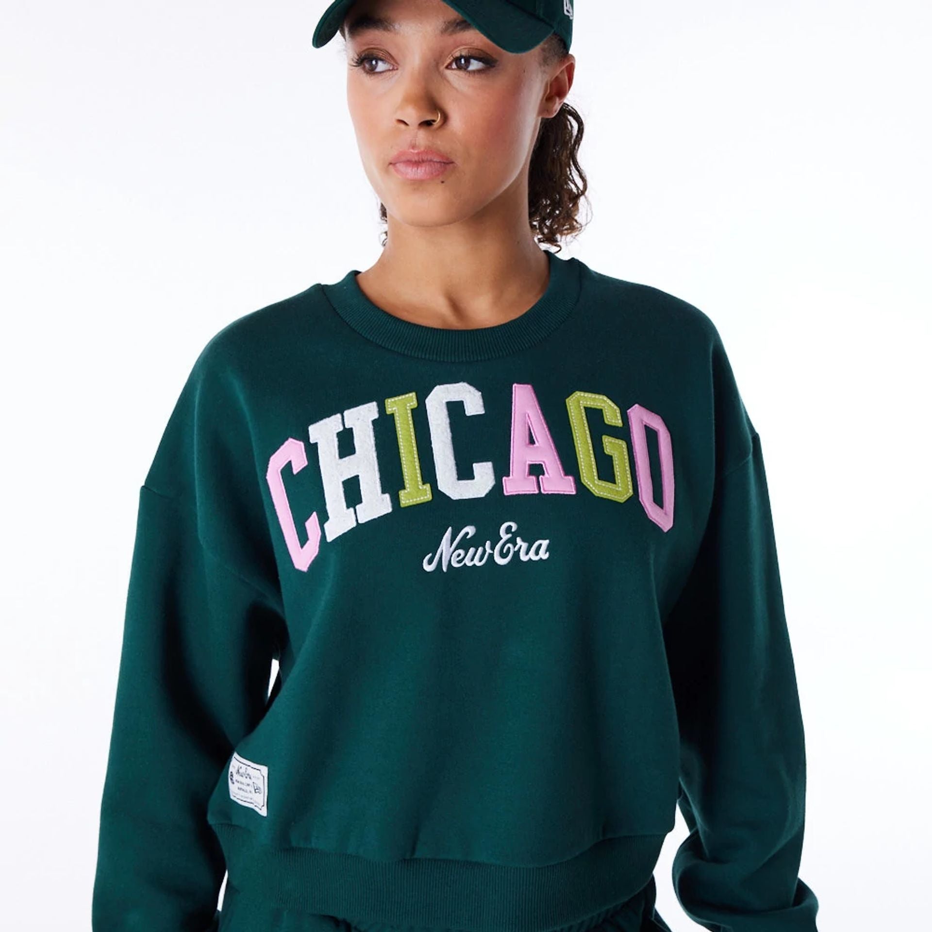 The Female model is wearing New Era Infill Dark Green Crop Crew Neck Sweatshirt 8