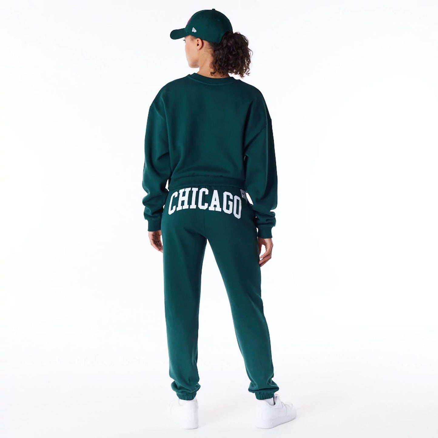 The Female model is wearing New Era Infill Dark Green Crop Crew Neck Sweatshirt 4