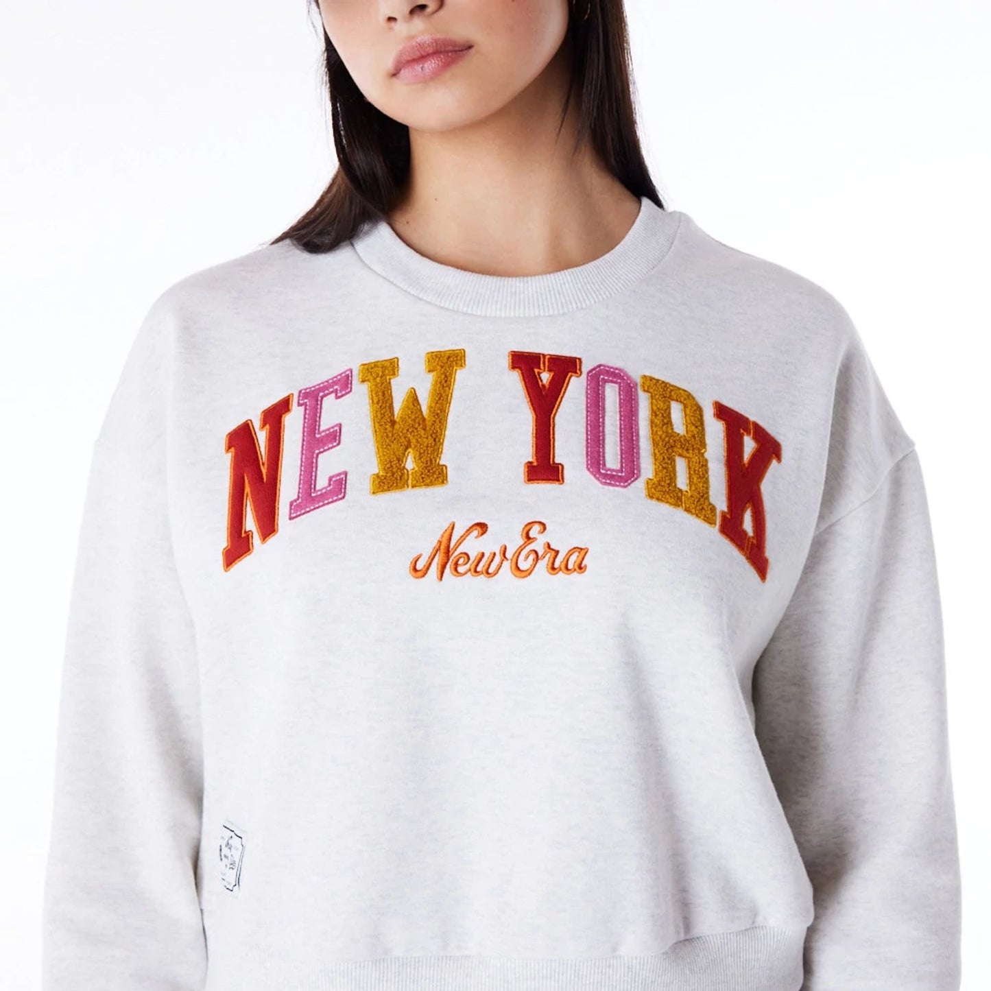 The Female model is wearing New Era Infill Grey Crop Crew Neck Sweatshirt 7