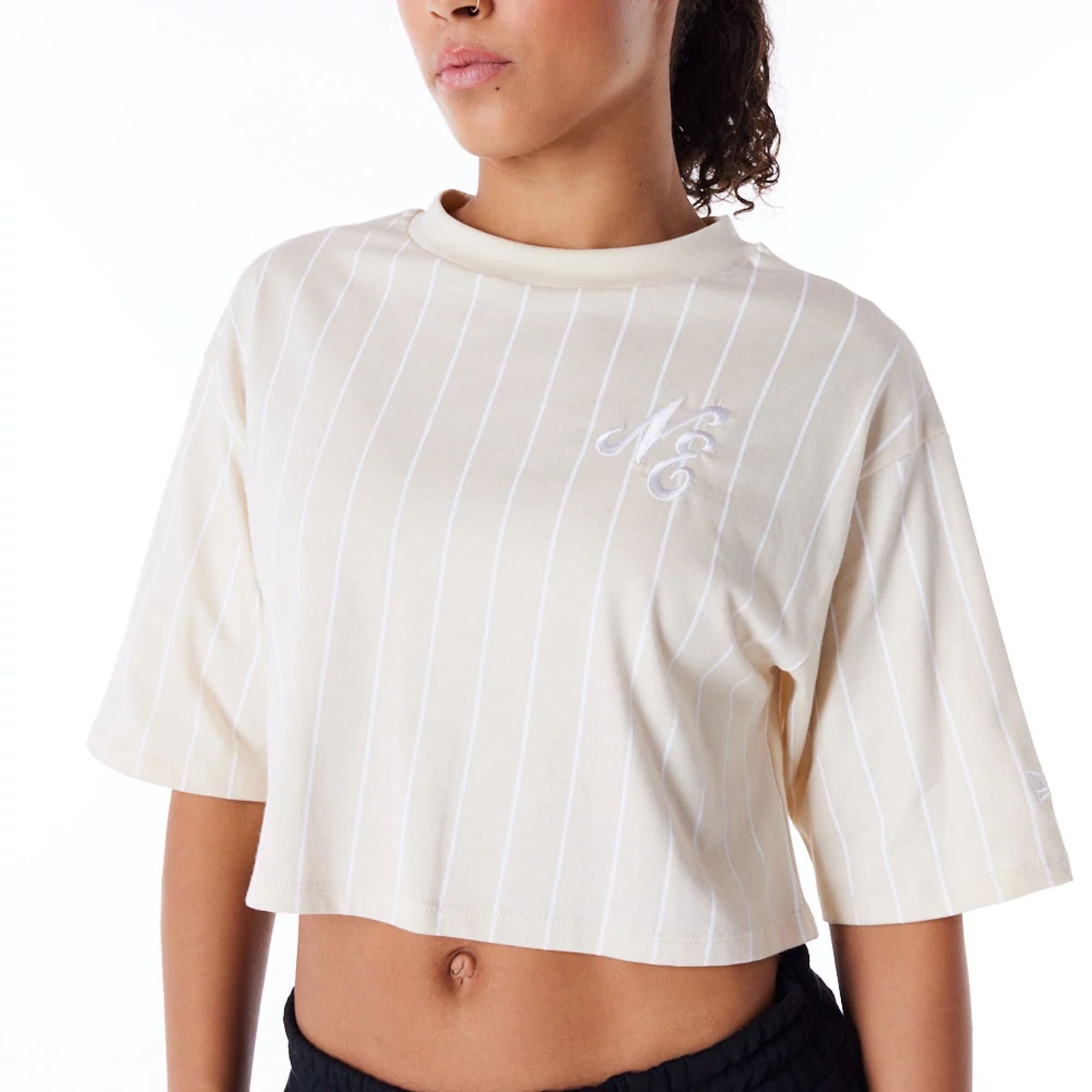 The Female model is wearing New Era Womens Pinstripe Light Beige Crop T-Shirt 2