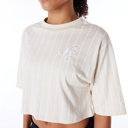 The Female model is wearing New Era Womens Pinstripe Light Beige Crop T-Shirt 4