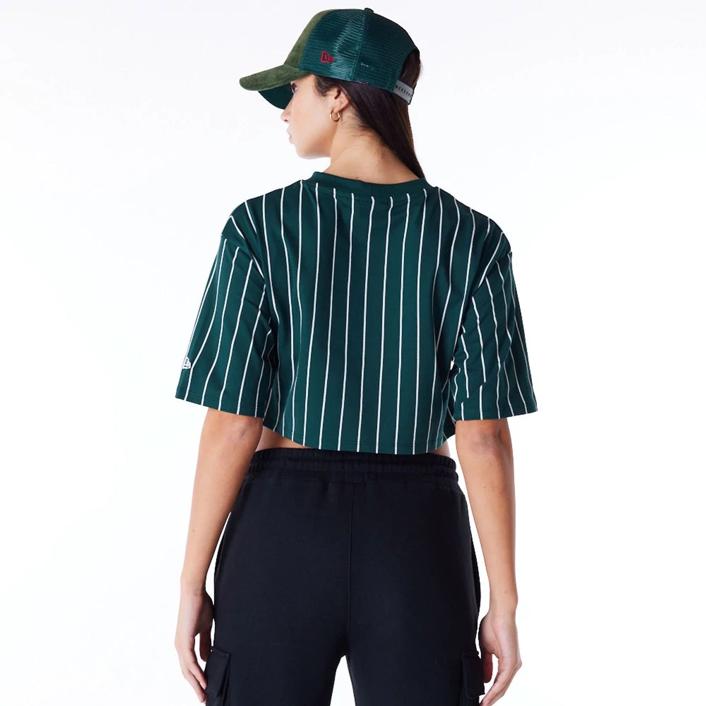 The Female model is wearing New Era Womens Pinstripe Dark Green Crop T-Shirt 7