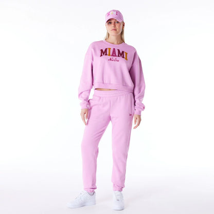 The Female model is wearing New Era Infill Pastel Pink Fleece Joggers 10