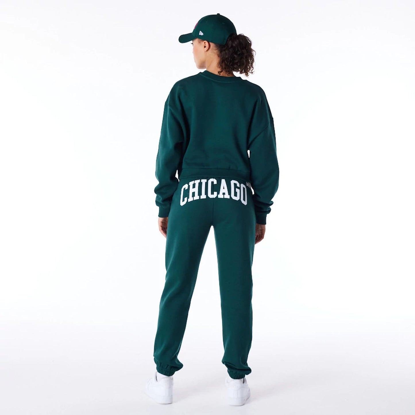 The Female model is wearing New Era Infill Dark Green Fleece Joggers 6