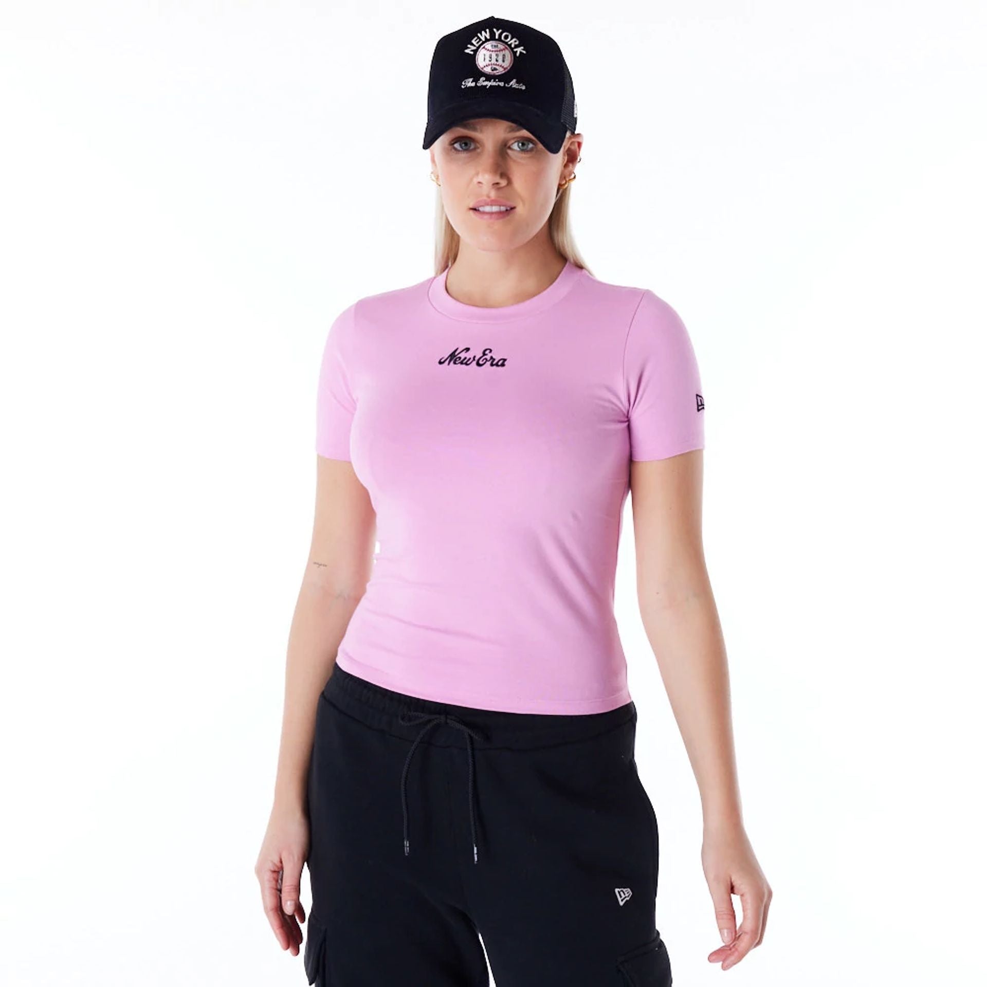 The Female model is wearing New Era Womens Pastel Pink Slim T-Shirt 1