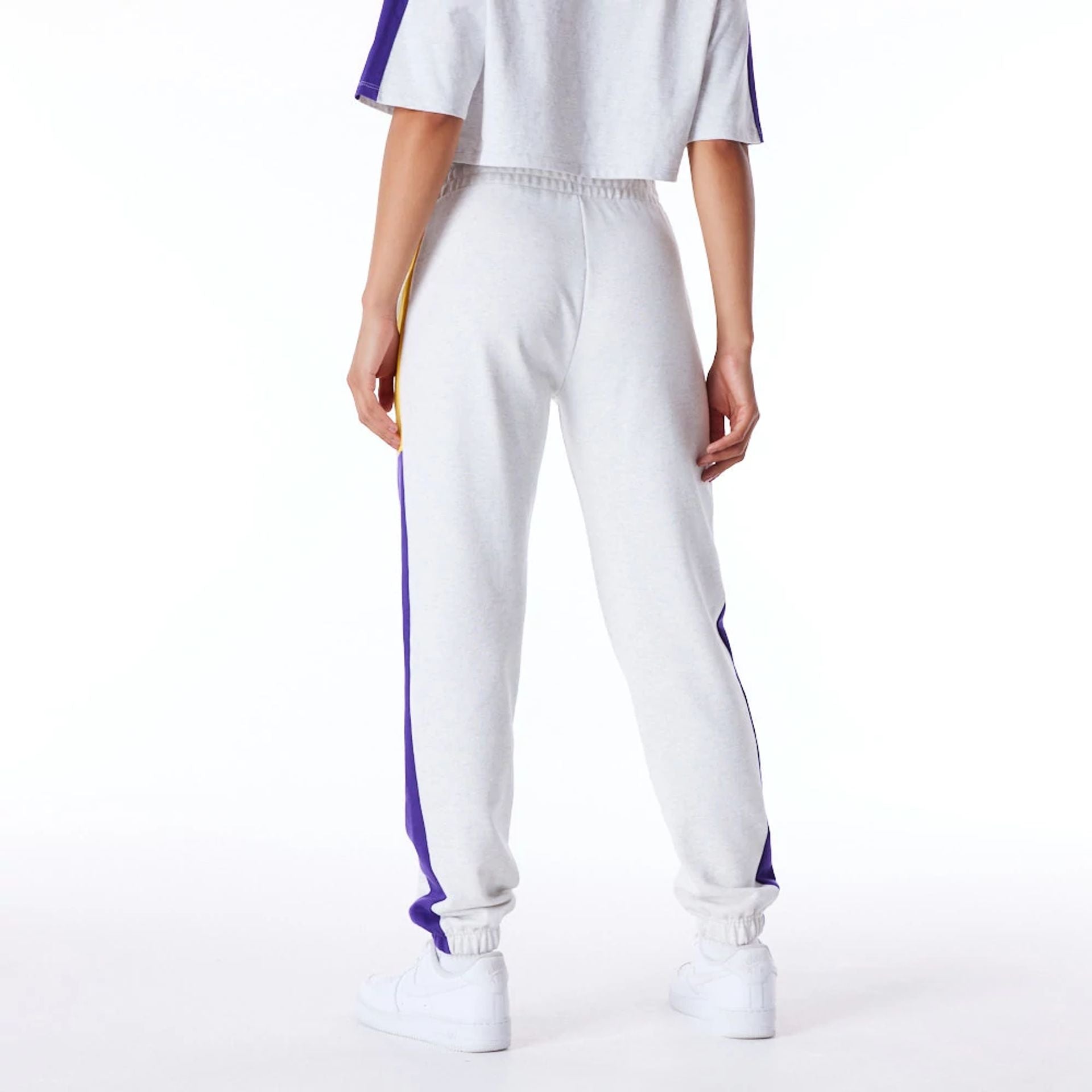 The Female model is wearing LA Lakers Womens NBA Colour Block Grey Fleece Joggers 2