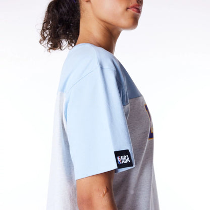 The Female model is wearing LA Lakers Womens NBA Pastel Blue Oversized T-Shirt 8