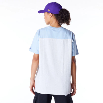 The Female model is wearing LA Lakers Womens NBA Pastel Blue Oversized T-Shirt 2