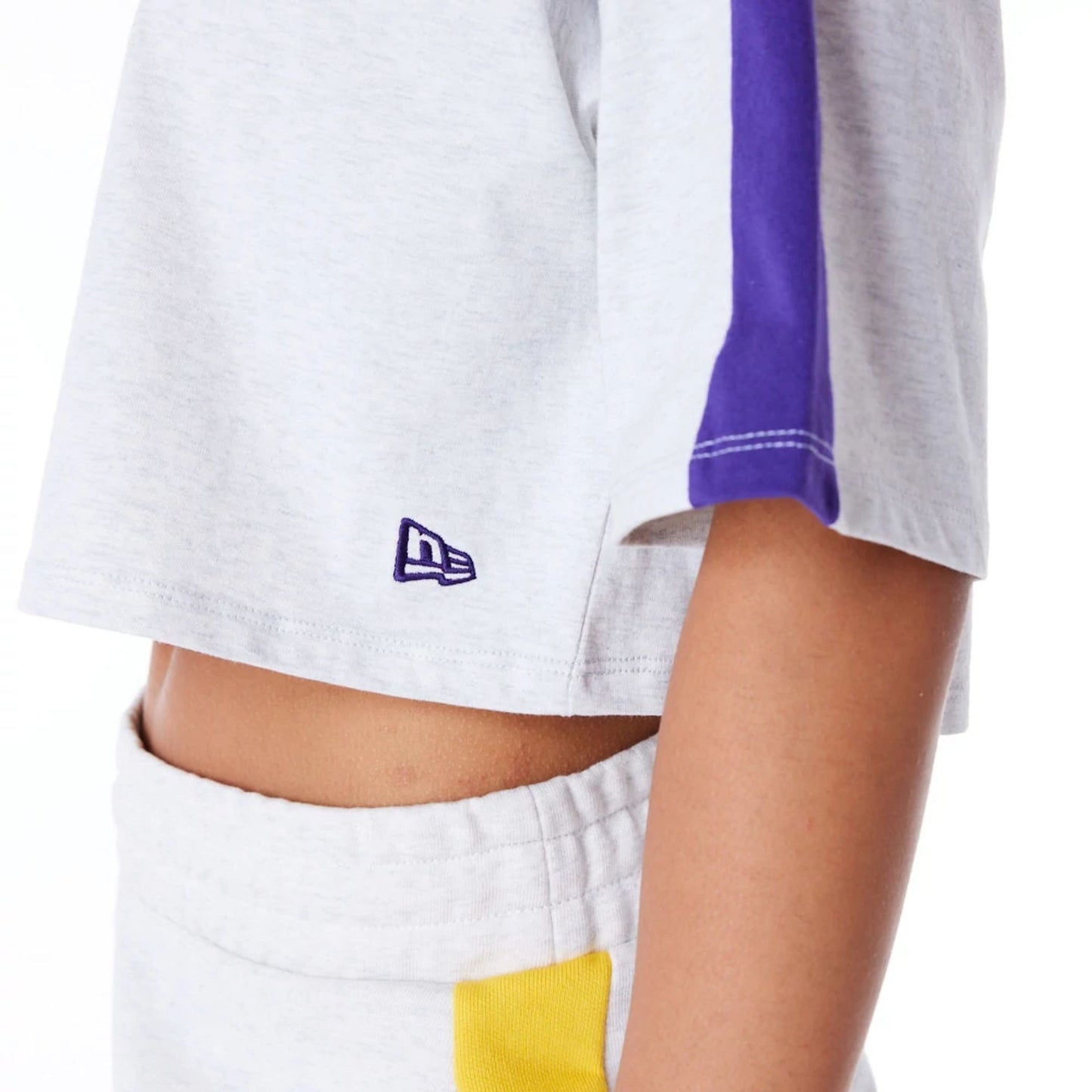 The Female model is wearing LA Lakers Womens NBA Colour Block Grey Crop T-Shirt 6