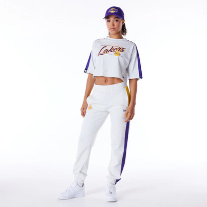 The Female model is wearing LA Lakers Womens NBA Colour Block Grey Crop T-Shirt 4