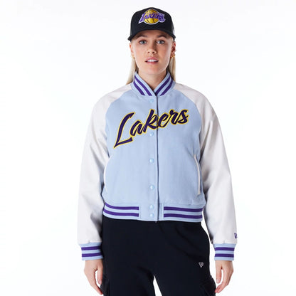 The Female model is wearing LA Lakers Womens NBA Pastel Blue Varsity Jacket 1