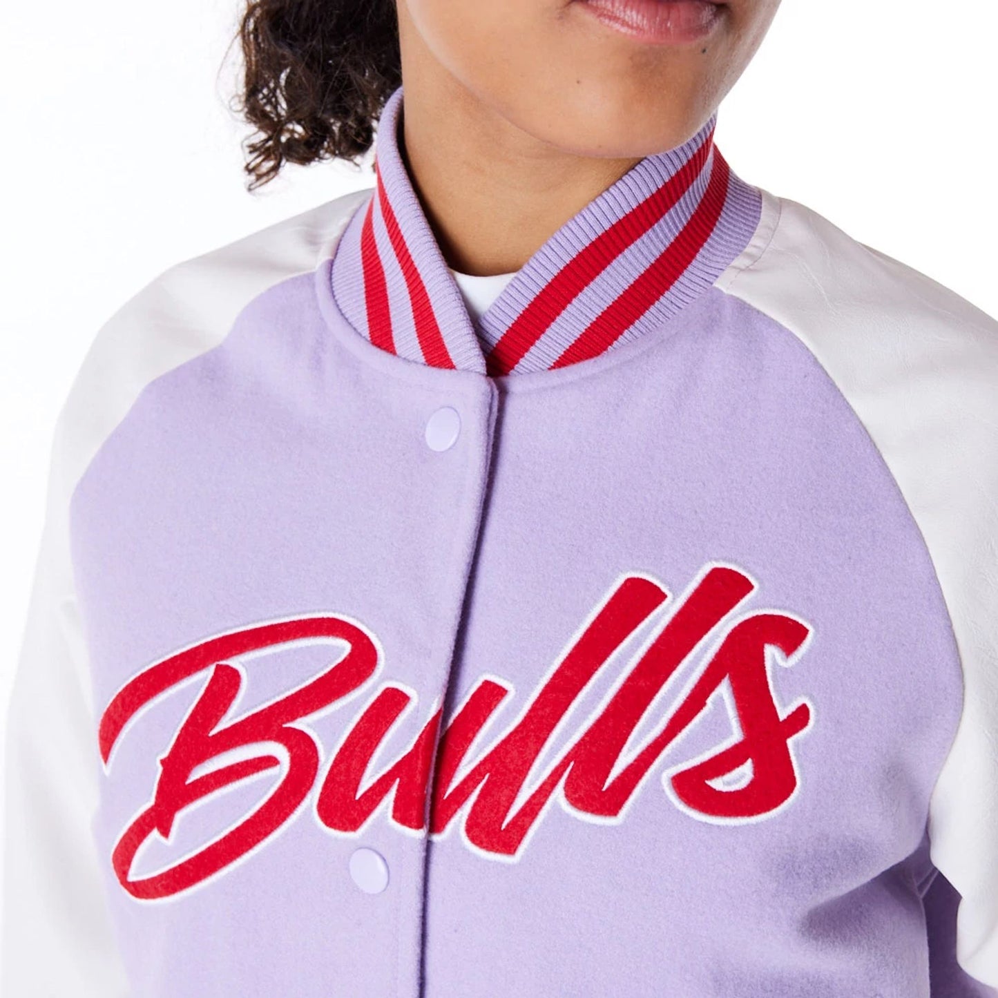 The Female model is wearing Chicago Bulls Womens NBA Pastel Purple Varsity Jacket 3