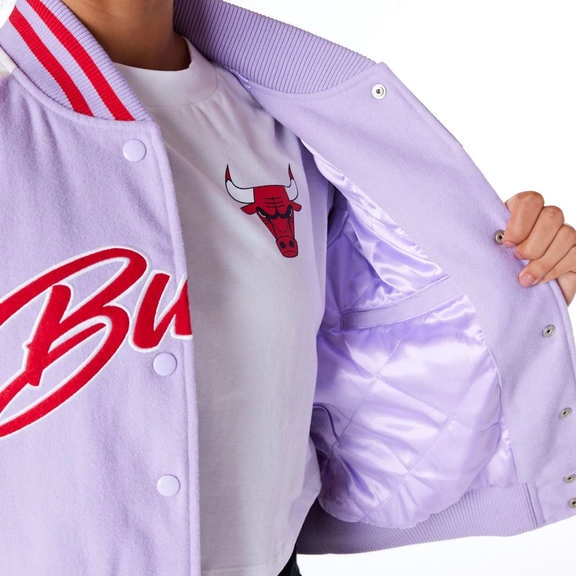 The Female model is wearing Chicago Bulls Womens NBA Pastel Purple Varsity Jacket 2