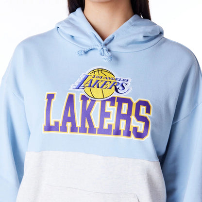 The Female model is wearing LA Lakers Womens NBA Pastel Blue Oversized Pullover Hoodie 2