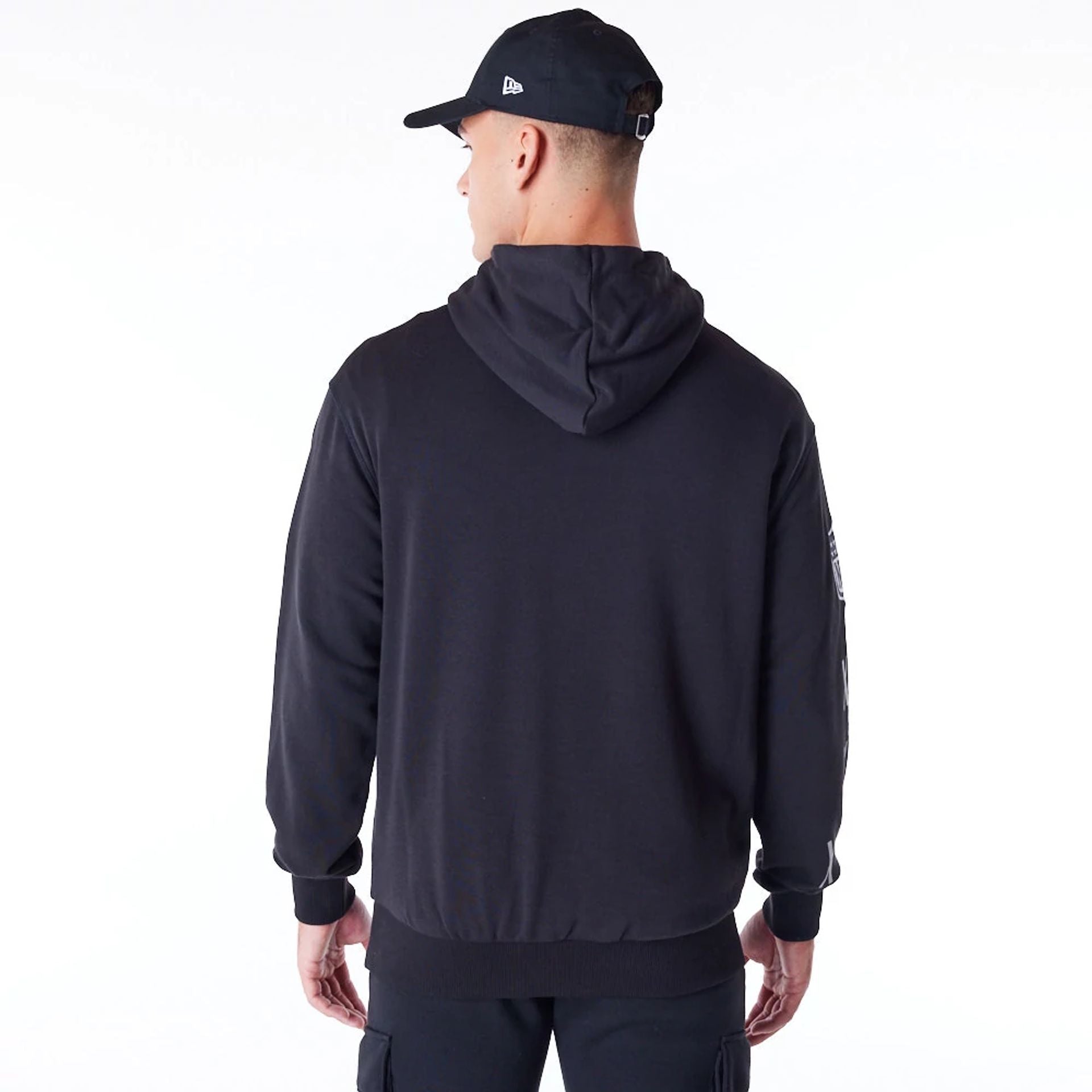 The Male model is wearing Las Vegas Raiders NFL Patch Black Oversized Pullover Hoodie 4