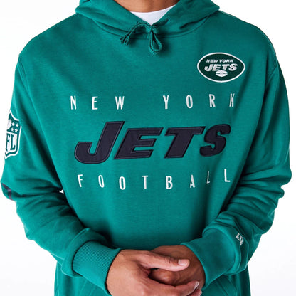 The Male model is wearing New York Jets NFL Patch Green Oversized Pullover Hoodie 7