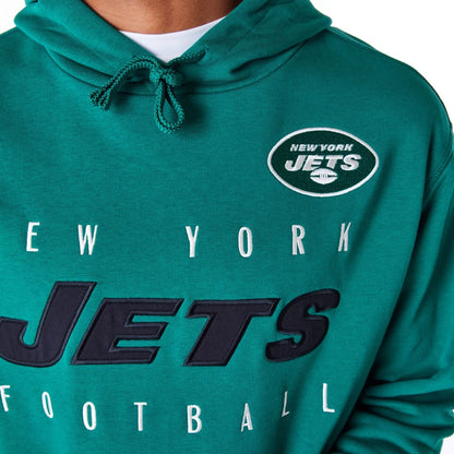 The Male model is wearing New York Jets NFL Patch Green Oversized Pullover Hoodie 3