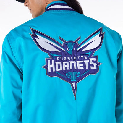 The Male model is wearing Charlotte Hornets NBA Satin Turquoise Bomber Jacket 2