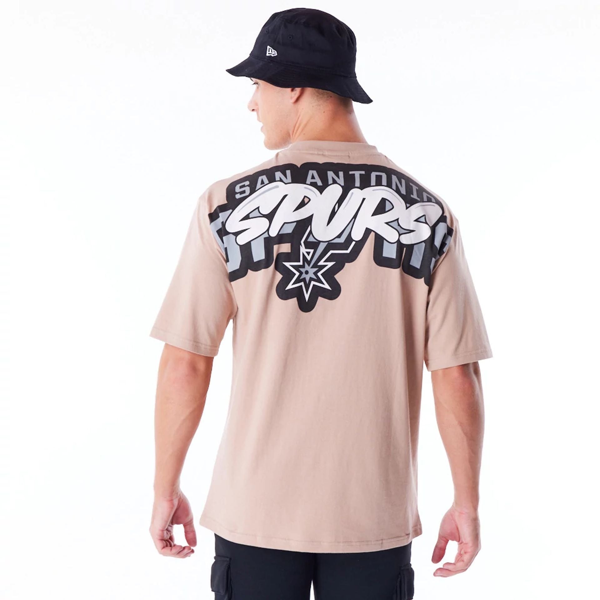 The Male model is wearing San Antonio Spurs NBA Wordmark Beige Oversized T-Shirt 3