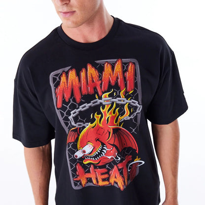 The Male model is wearing Miami Heat Graphic Black Drop Shoulder T-Shirt 1