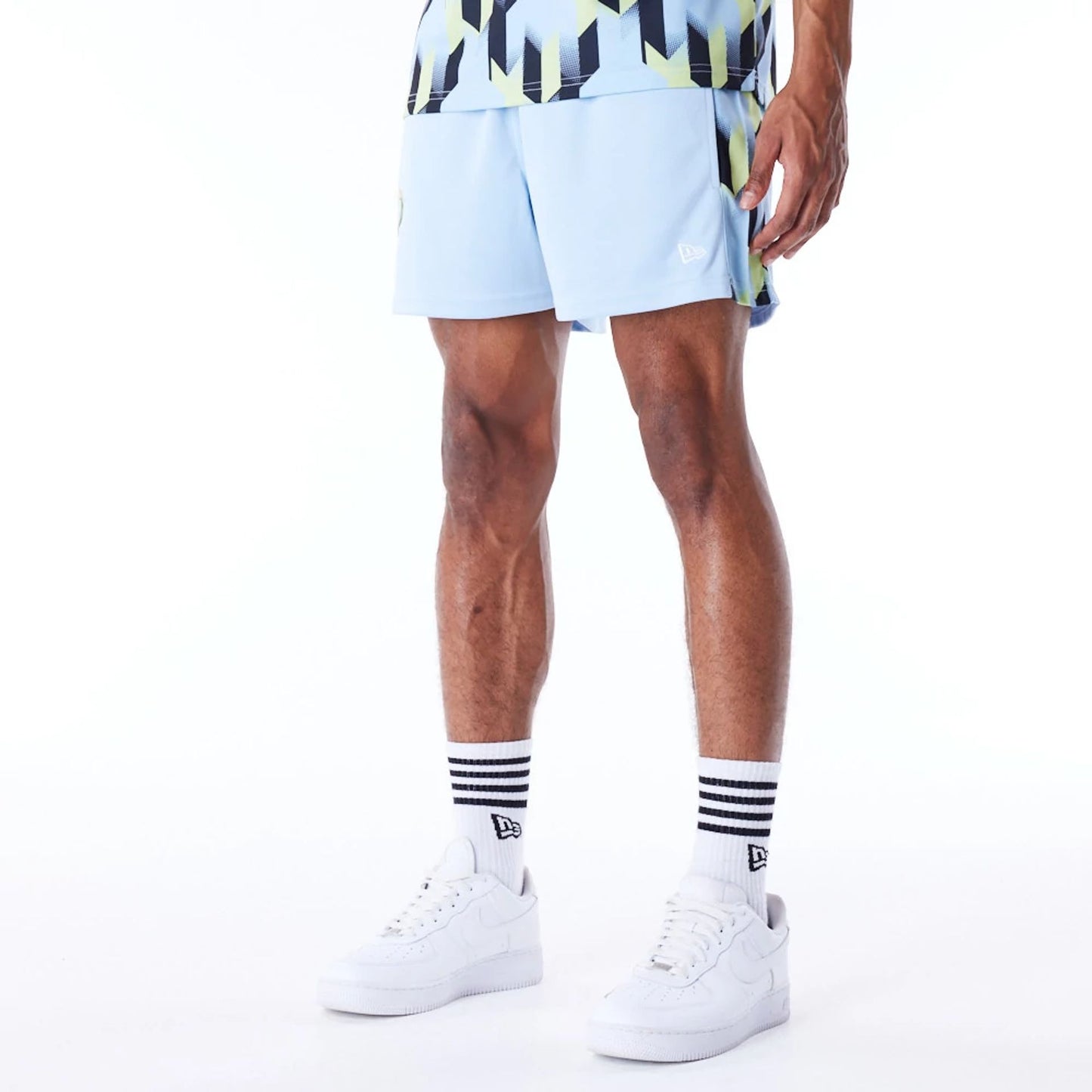 The Male model is wearing Milwaukee Bucks NBA Soccer Pastel Blue Short Shorts 5