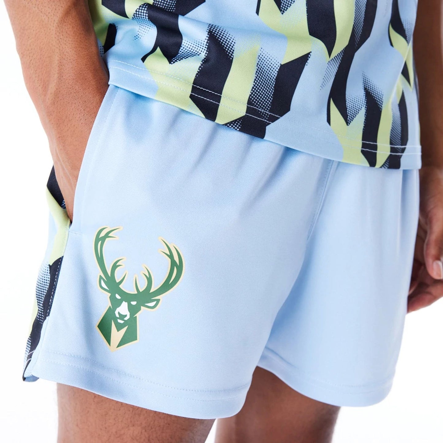 The Male model is wearing Milwaukee Bucks NBA Soccer Pastel Blue Short Shorts 1