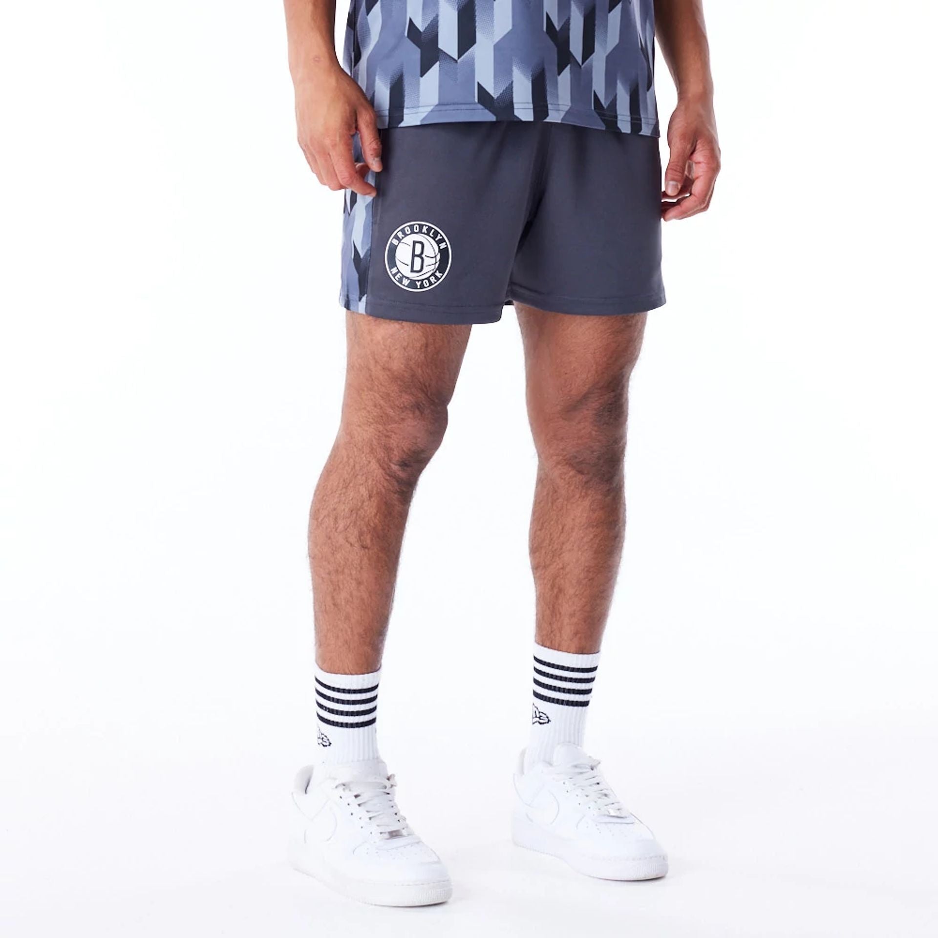 The Male model is wearing Brooklyn Nets NBA Soccer Dark Grey Short Shorts 1