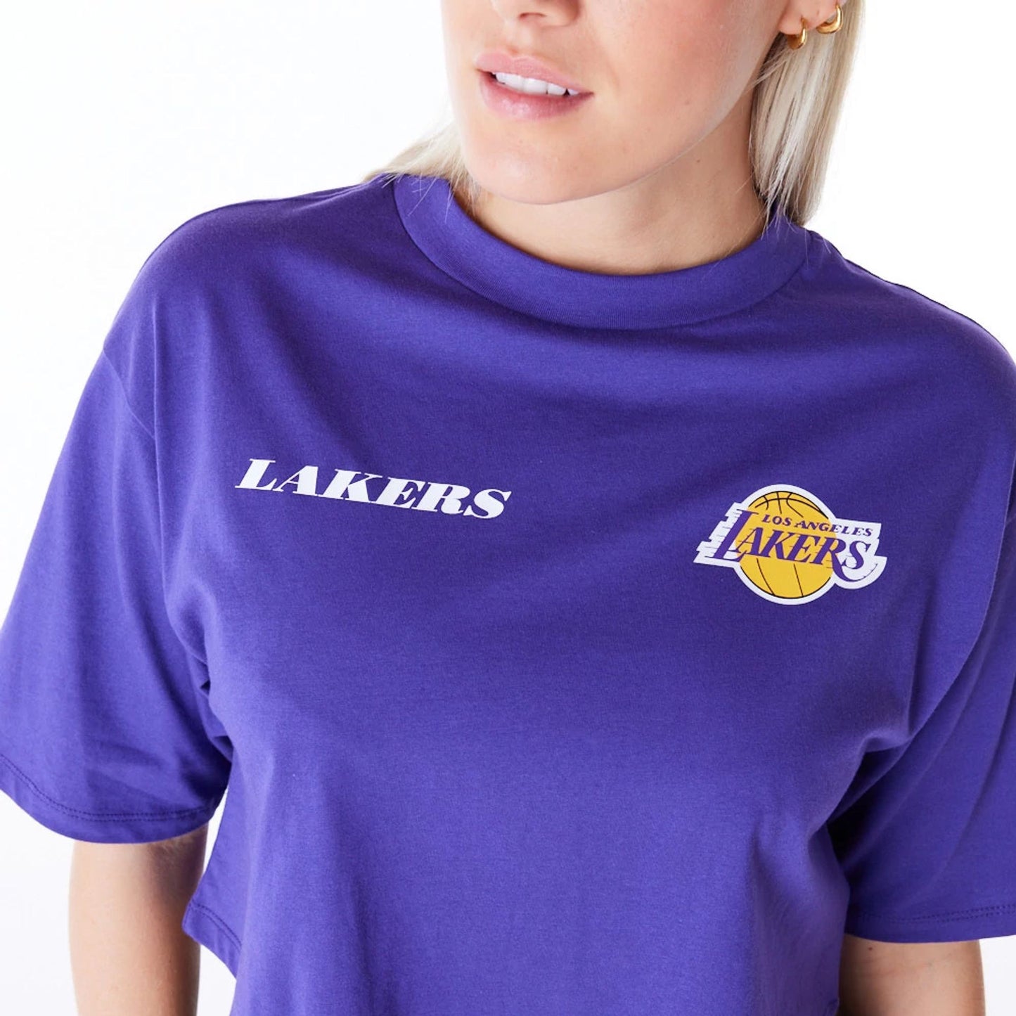 The Female model is wearing LA Lakers Womens NBA Team Logo Wordmark Purple Crop T-Shirt 8