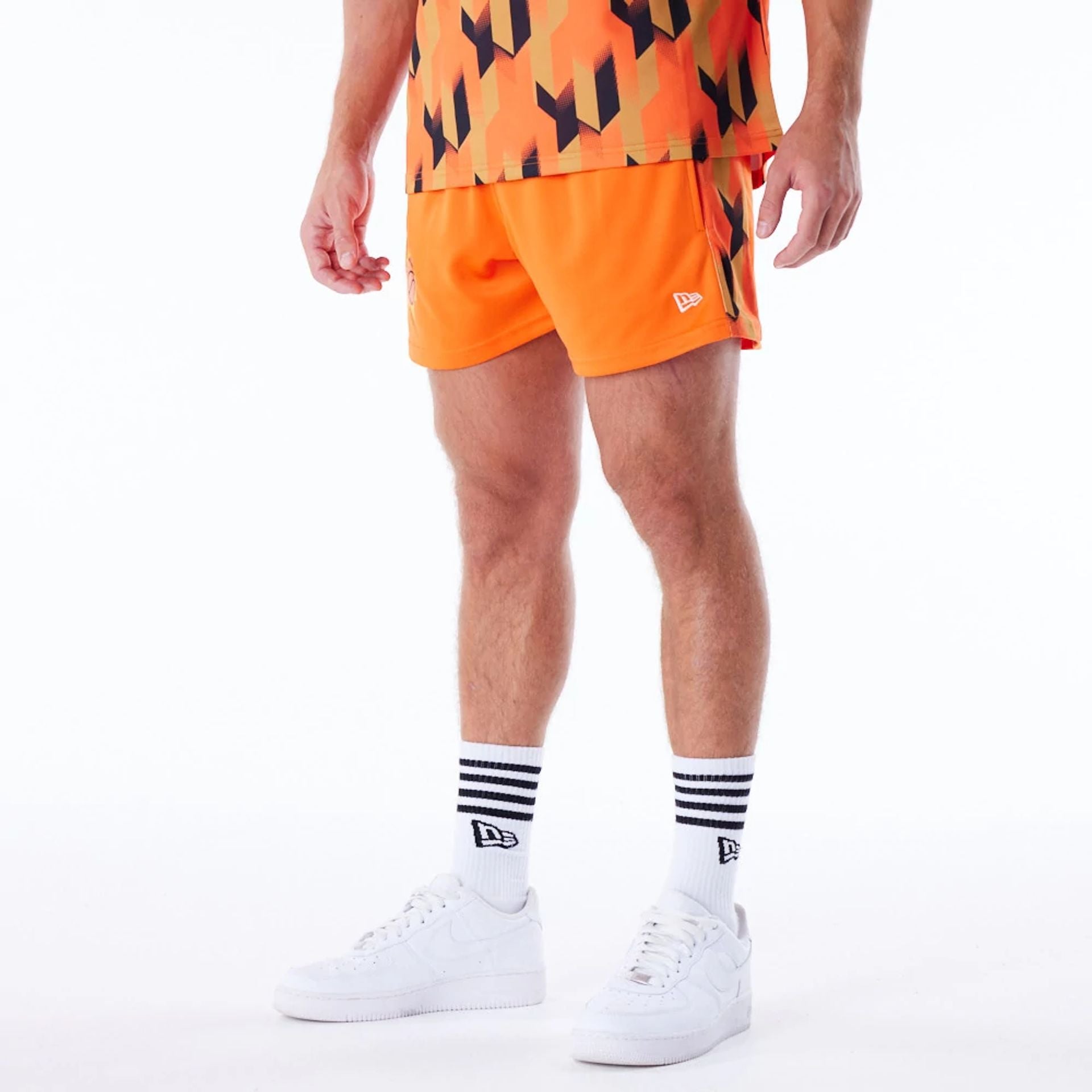 The Male model is wearing Phoenix Suns NBA Soccer Orange Short Shorts 7