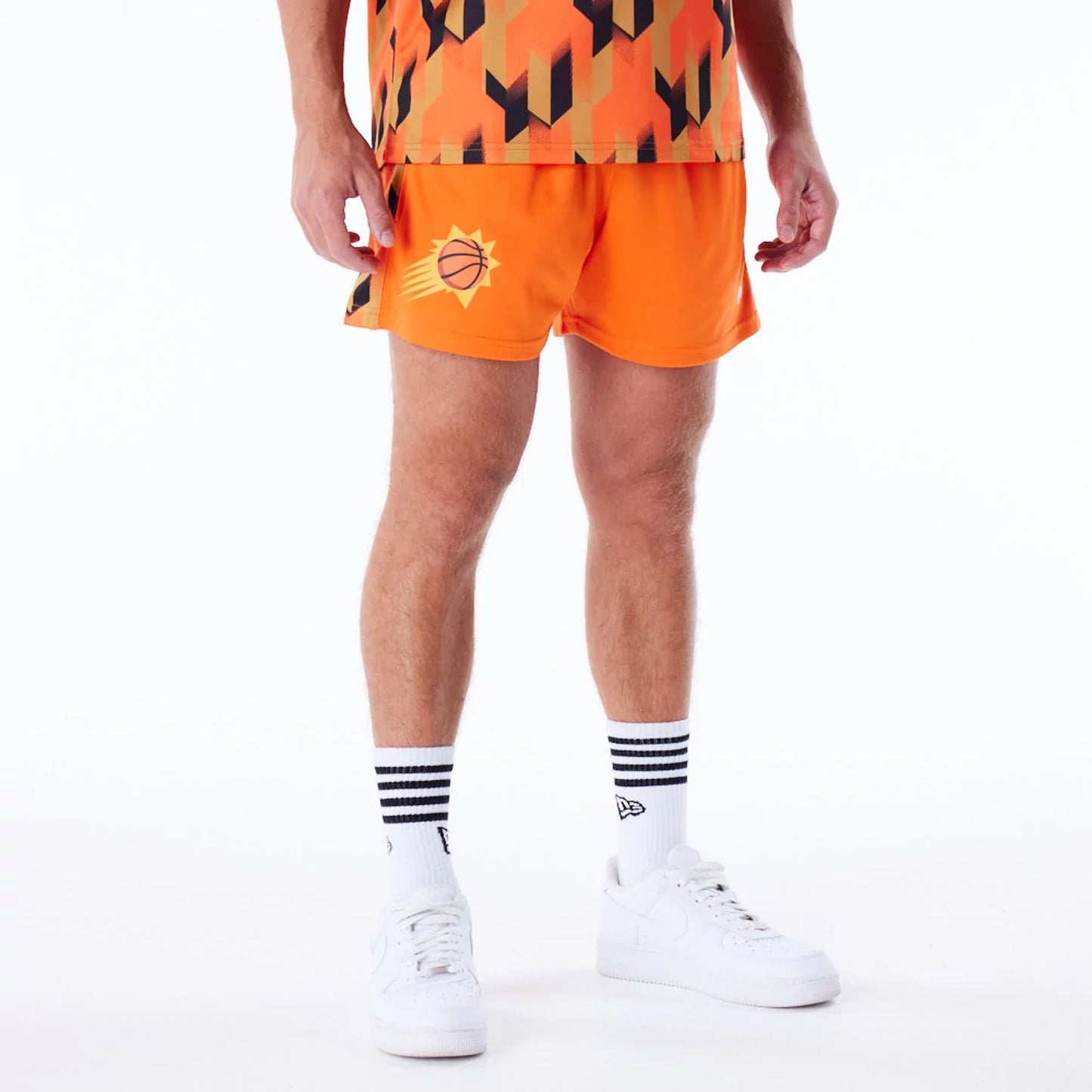 The Male model is wearing Phoenix Suns NBA Soccer Orange Short Shorts 6