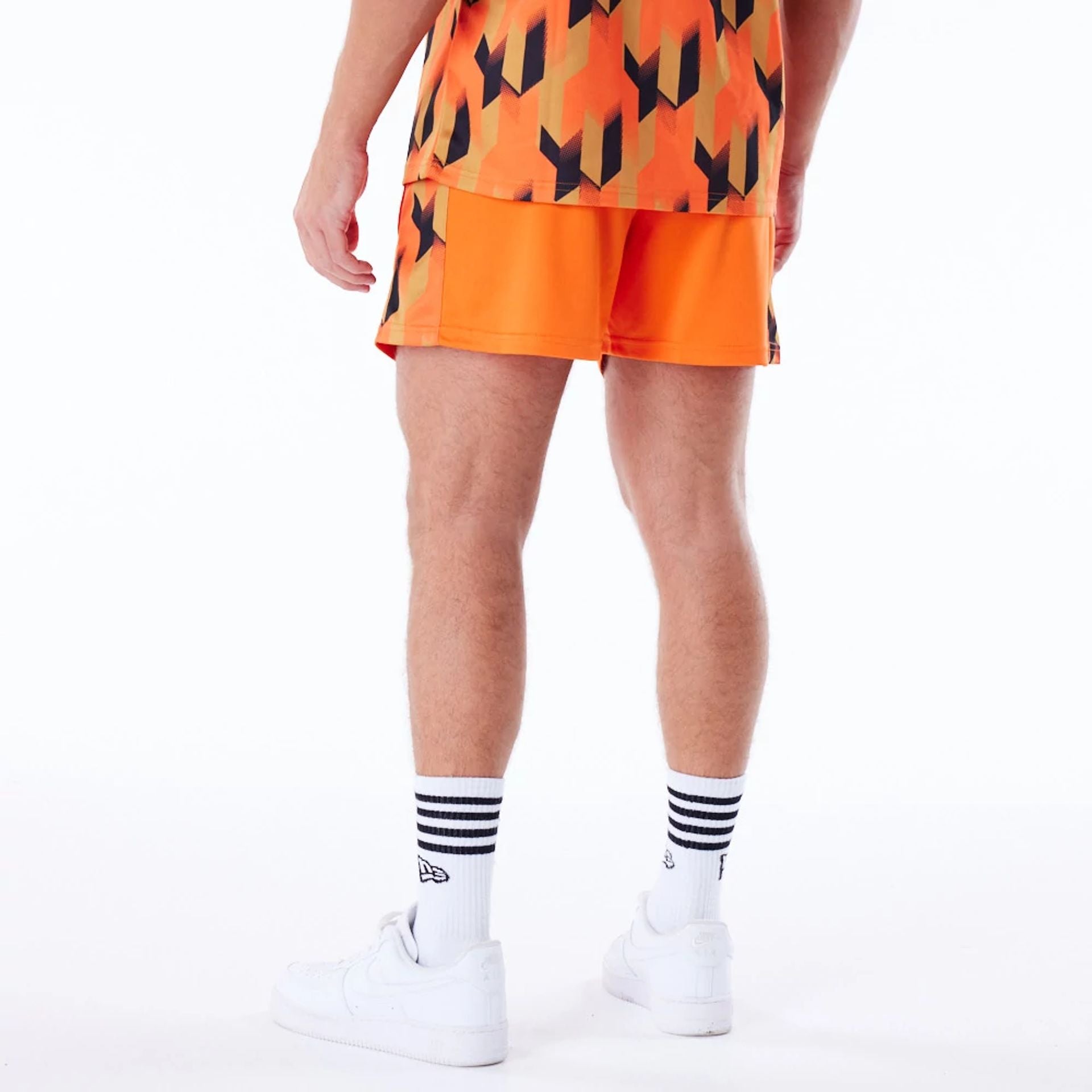 The Male model is wearing Phoenix Suns NBA Soccer Orange Short Shorts 2