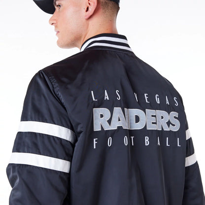 The Male model is wearing Las Vegas Raiders NFL Satin Black Bomber Jacket 7