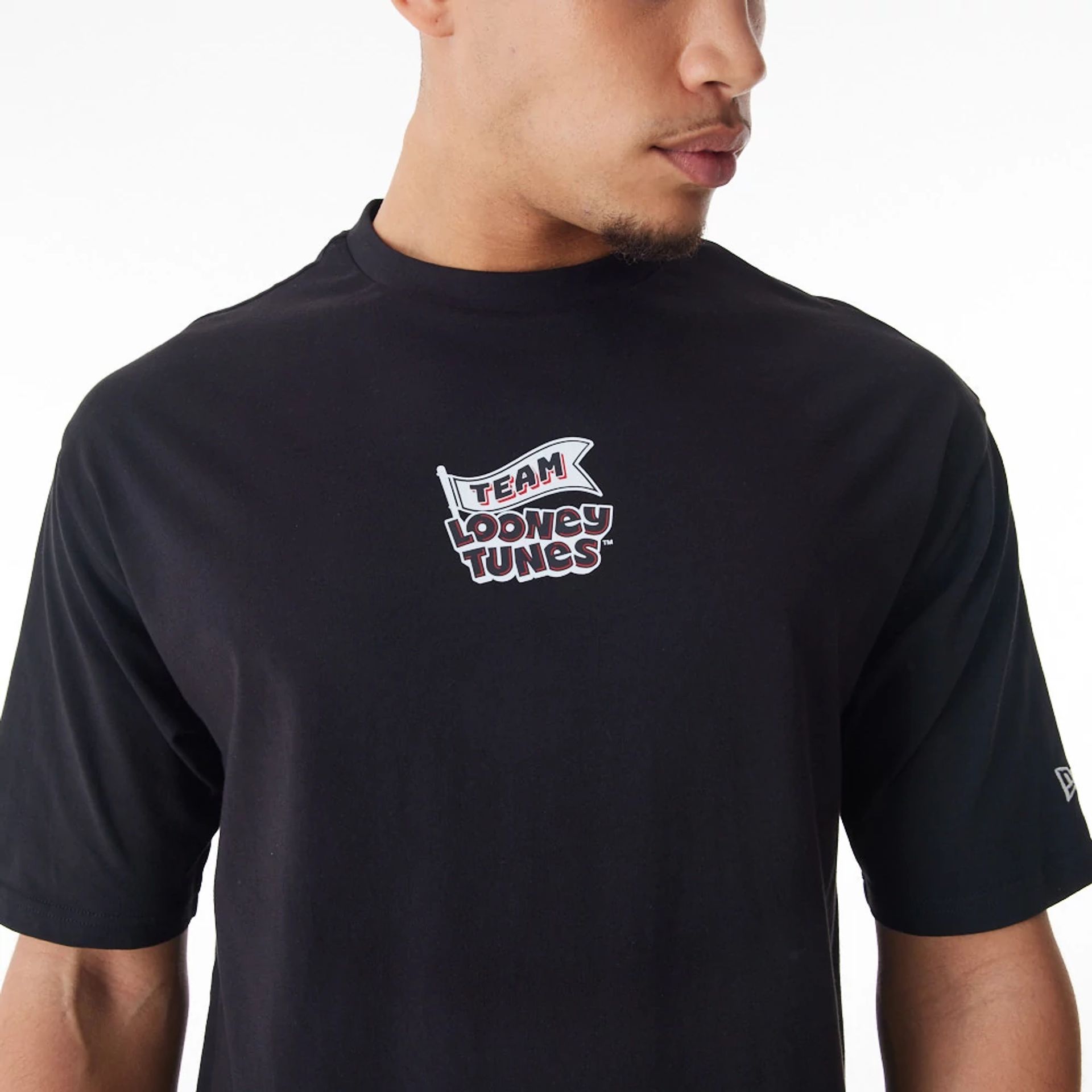 The Male model is wearing Multi Character Team Looney Tunes Black Oversized T-Shirt  1