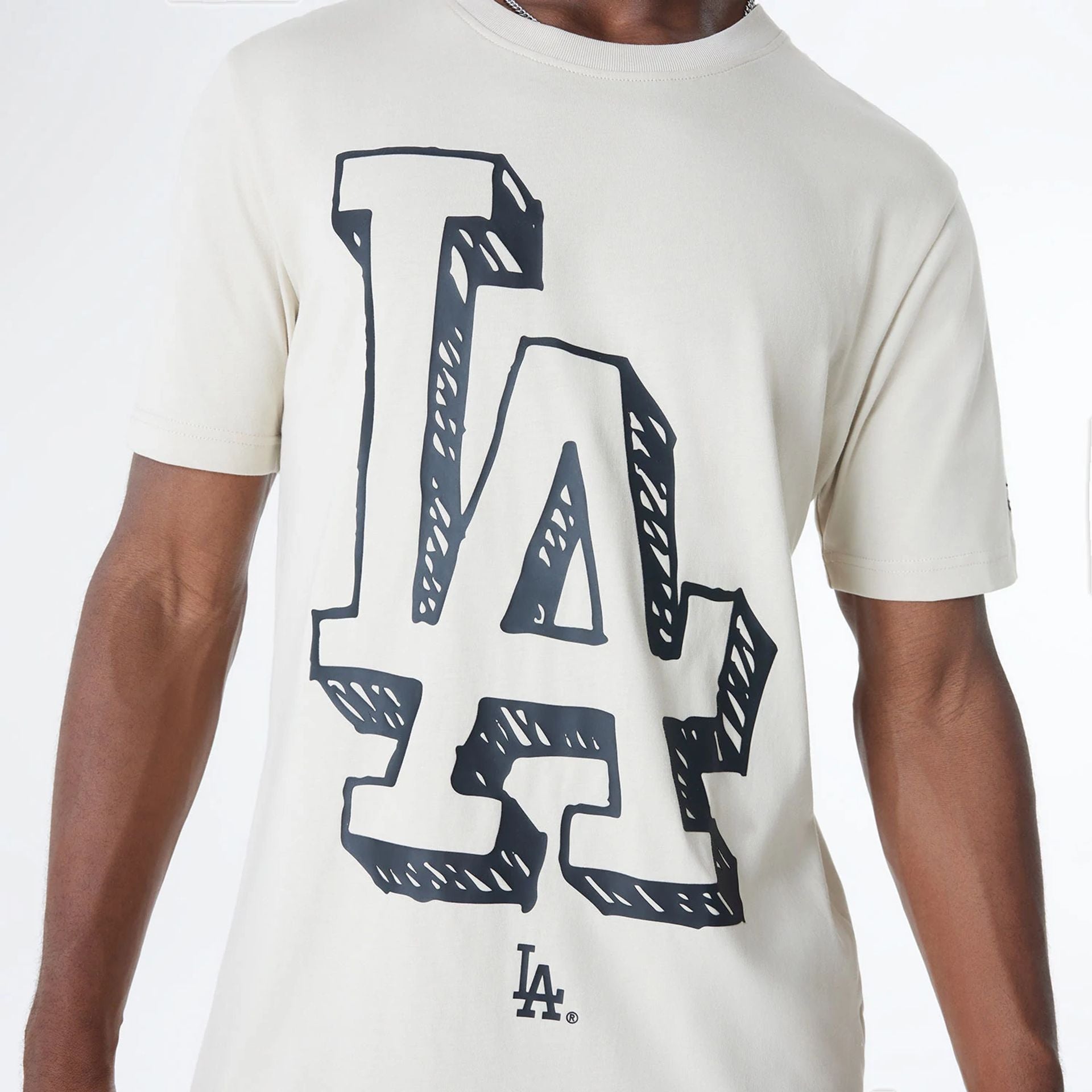 The Male model is wearing LA Dodgers Official Doodles Light Beige T-Shirt 3