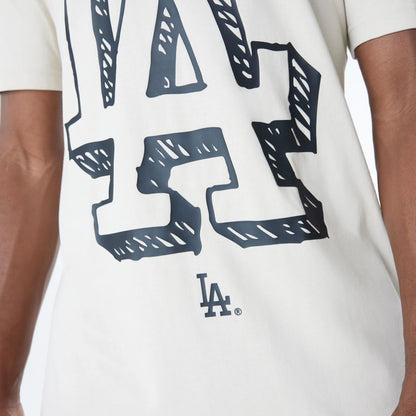 The Male model is wearing LA Dodgers Official Doodles Light Beige T-Shirt 5