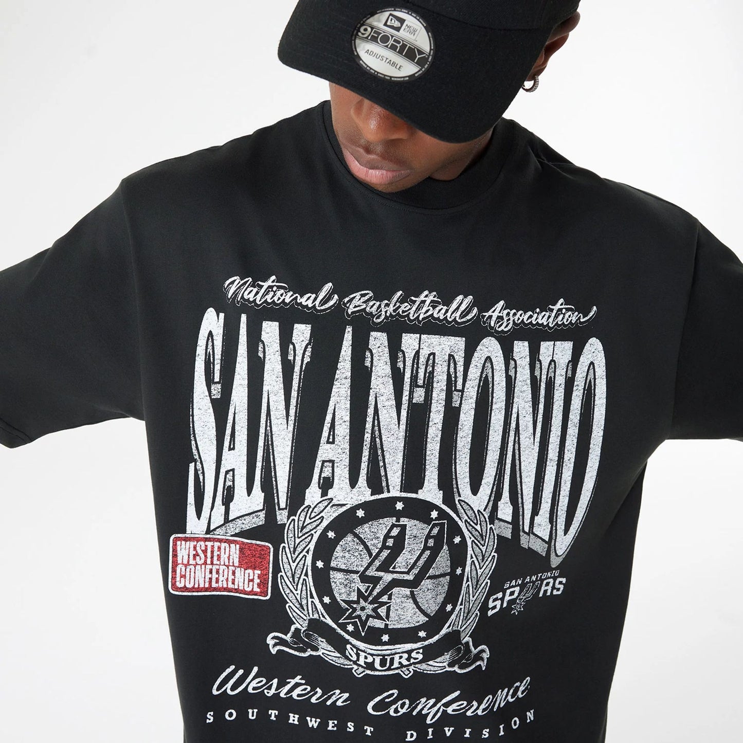 The Male model is wearing San Antonio Spurs Oversized Essential Black Oversized T-Shirt 5