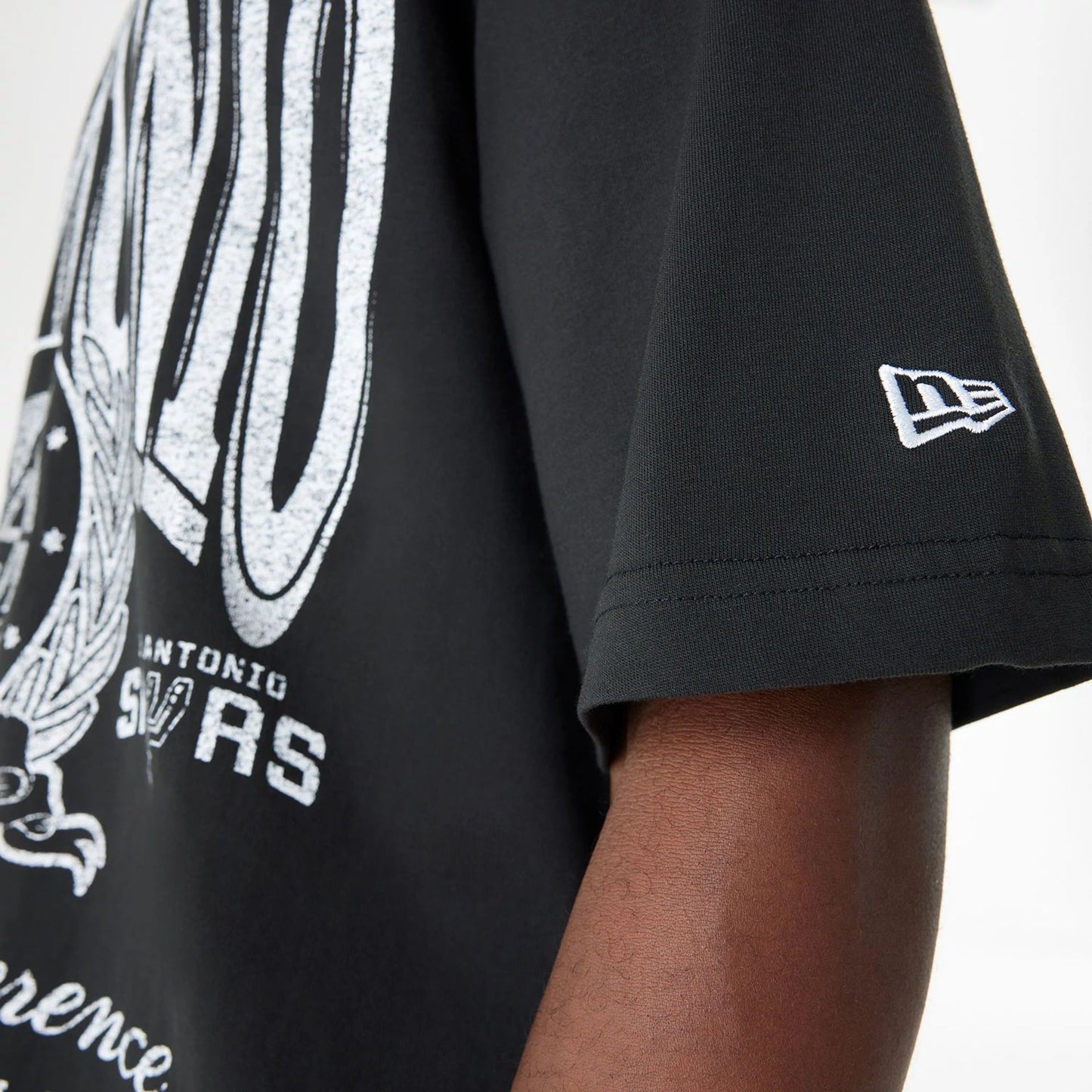 The Male model is wearing San Antonio Spurs Oversized Essential Black Oversized T-Shirt 4