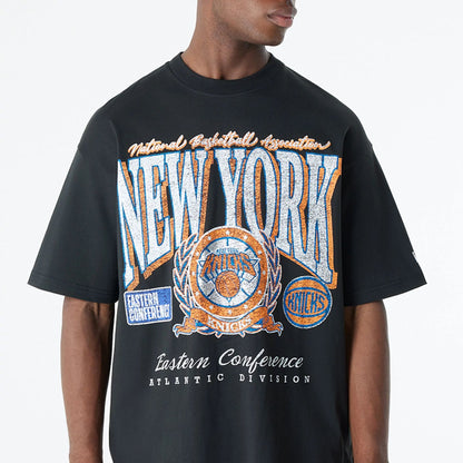 The Male model is wearing New York Knicks Oversized Essential Black Oversized T-Shirt 3