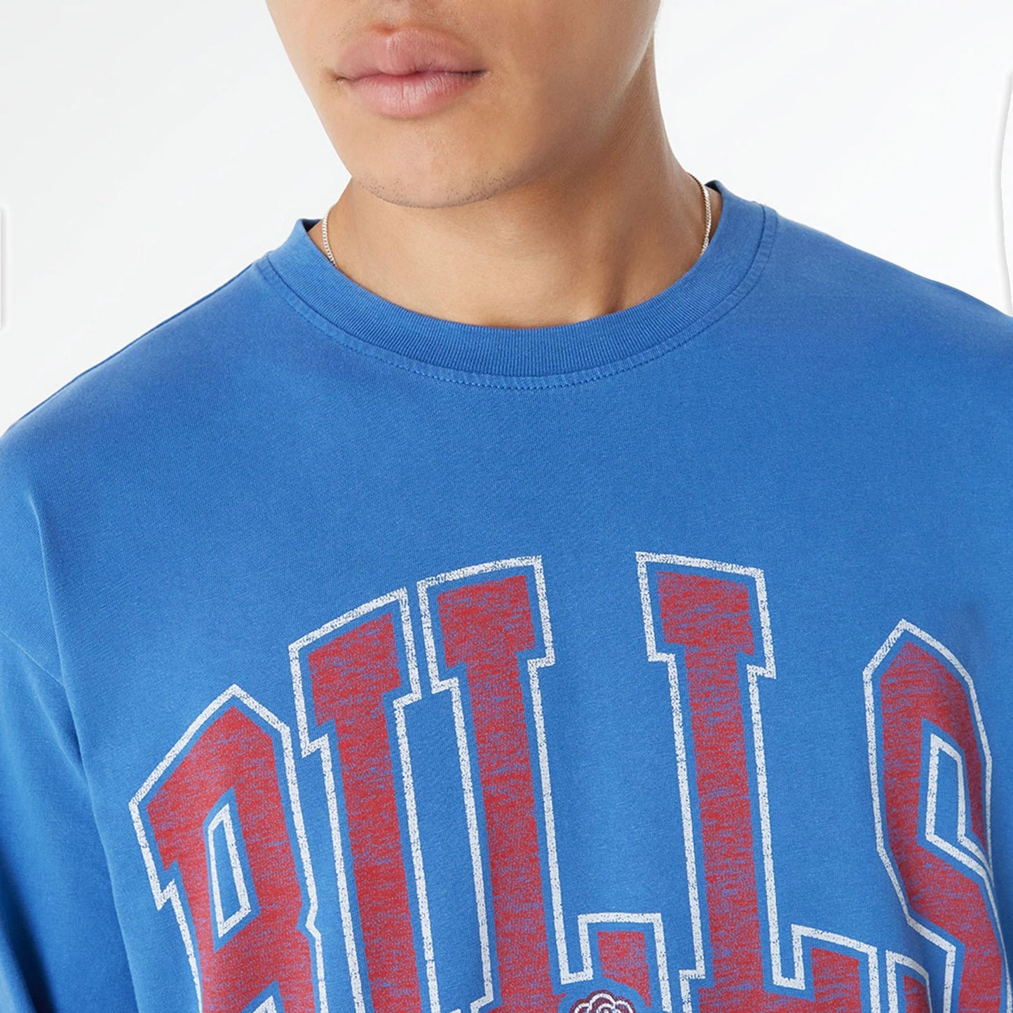 The Male model is wearing Buffalo Bills Oversized Essential Blue Oversized Long Sleeve T-Shirt 6