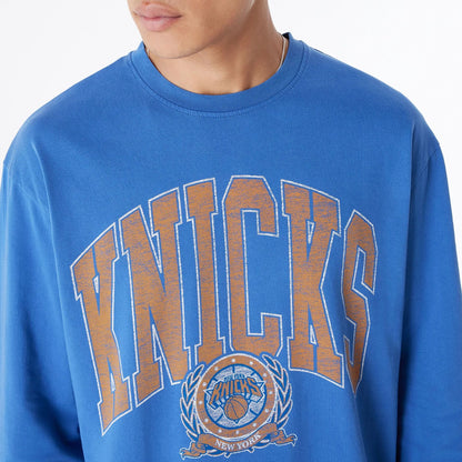 The Male model is wearing New York Knicks Oversized Essential Blue Oversized Long Sleeve T-Shirt 6