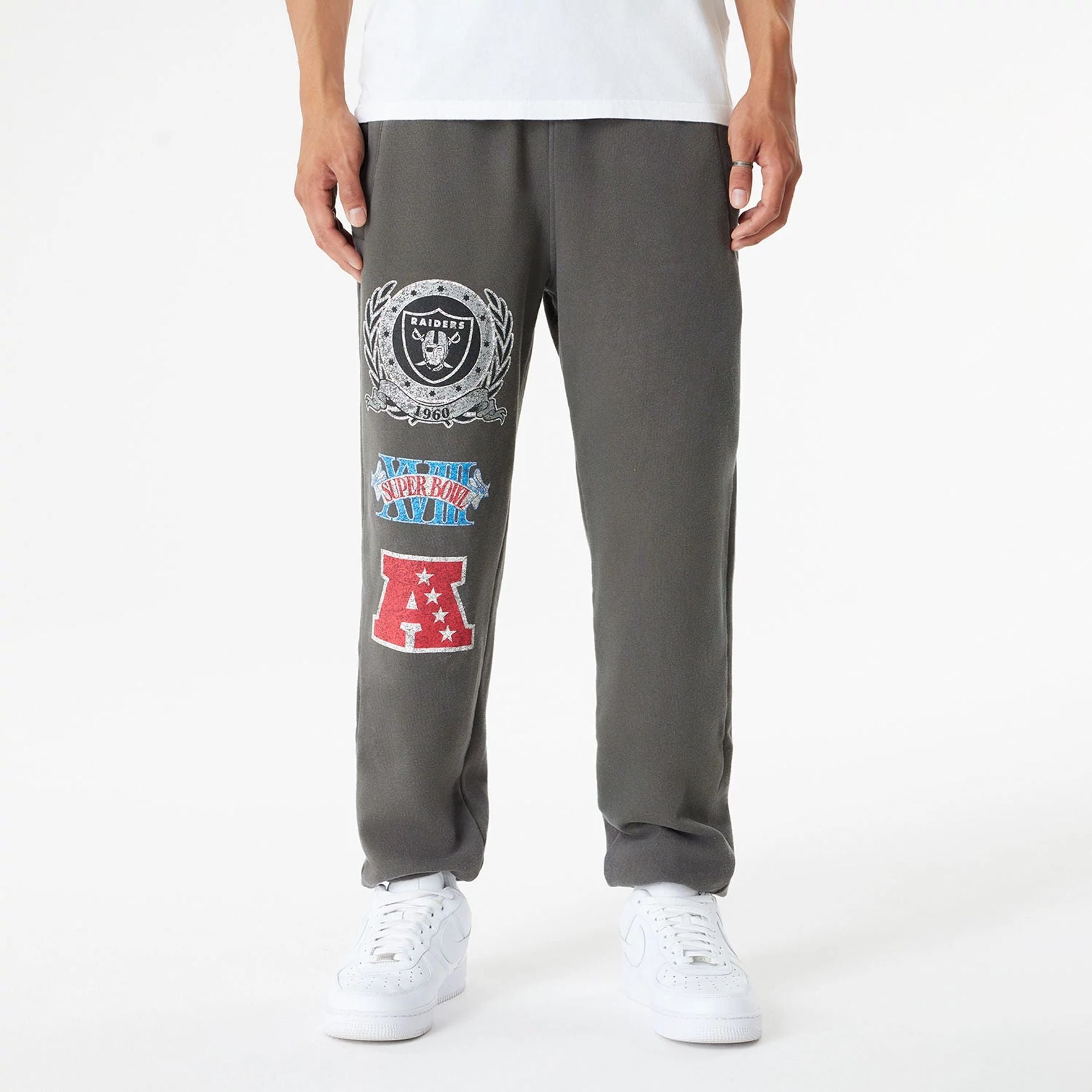 The Male model is wearing Las Vegas Raiders Oversized Essential Dark Grey Oversized Joggers 1