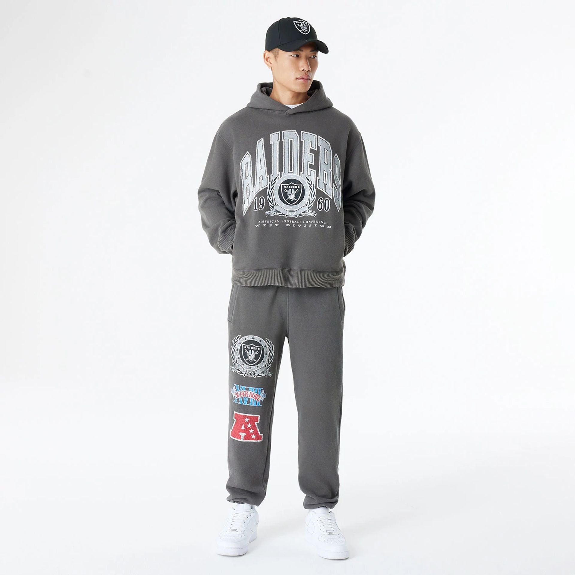 The Male model is wearing Las Vegas Raiders Oversized Essential Dark Grey Oversized Joggers 8