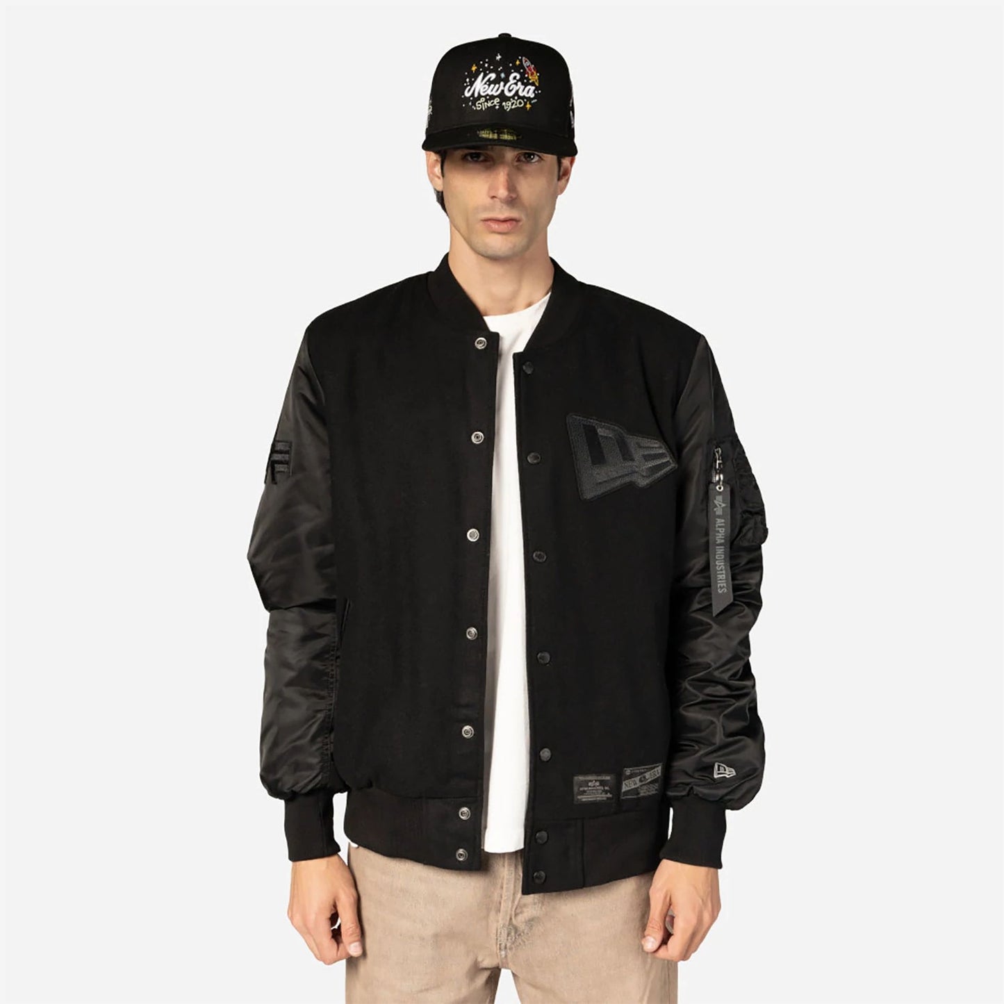 The Male model is wearing New Era x Alpha Industries Black Varsity Jacket 3