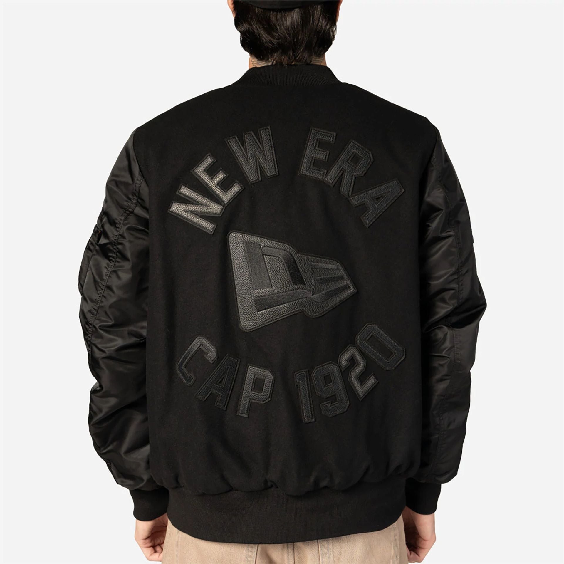 The Male model is wearing New Era x Alpha Industries Black Varsity Jacket 8