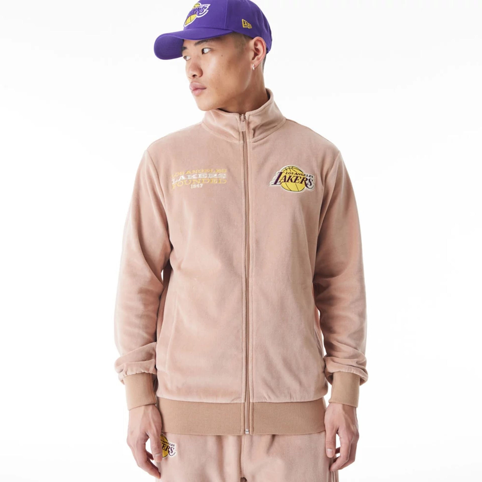 The Male model is wearing LA Lakers NBA Lifestyle Velour Beige Track Jacket  1